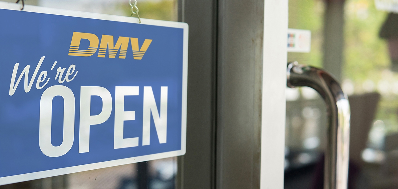 Open sign on door at DMV.